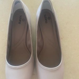 Woman’s nude wedge heels